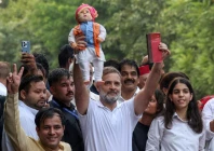 congress leader and leader of the opposition rahul gandhi holds a doll depicting indian prime minister narendra modi as opposition parties march to the supreme court to protest a controversial revision of voter lists that has sparked days of unrest in new delhi india reuters