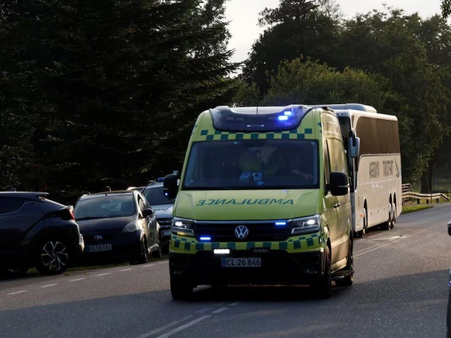 an ambulance and a bus approach near the site where a passenger train en route to soenderborg derailed in the village of bjerndrup between kliplev and tinglev in southern jutland denmark august 15 2025 photo reuters an ambulance and a bus approach near the site where a passenger train en route to soenderborg derailed in the village of bjerndrup between kliplev and tinglev in southern jutland denmark august 15 2025 photo reuters