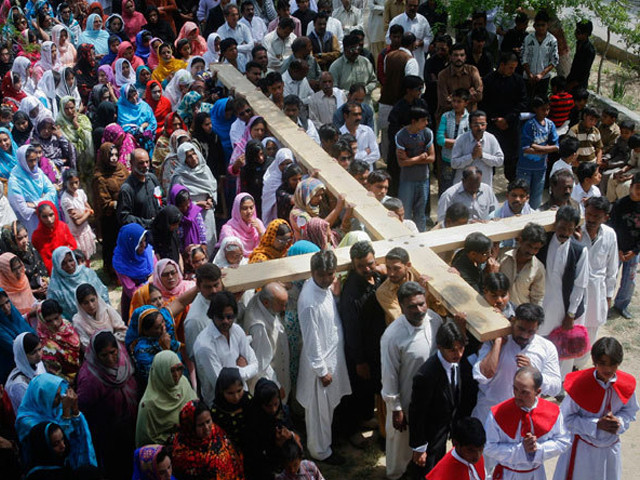 christians carry a cross while observing good friday in pakistan photo reuters