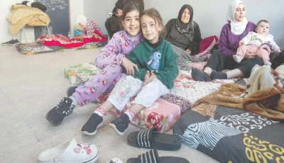 women and children seek refuge in a classroom at a school transformed into a shelter in sidon photo afp