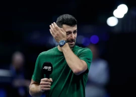 serbia s novak djokovic reacts during a tribute to his former coach nikola pilic after winning his round of 16 match against chile s alejandro tabilo reuters
