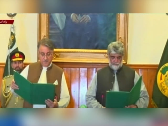 balochistan governor malik abdul wali khan kakar administering the oath to mir ali mardan domki photo file