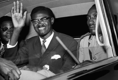 patrice lumumba waves from his car after arriving at a new york airport on july 24 1960 photo afp file
