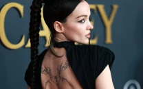 dove cameron shows tattoos in black dress at musicares person of the year