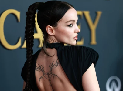 dove cameron shows tattoos in black dress at musicares person of the year