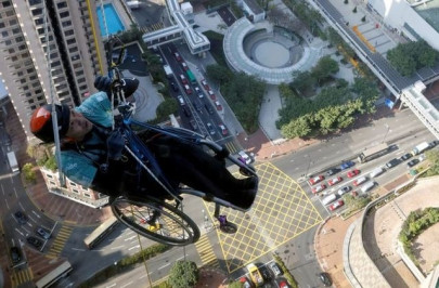 in wheelchair paraplegic lai chi wai climbs up skyscraper in hong kong