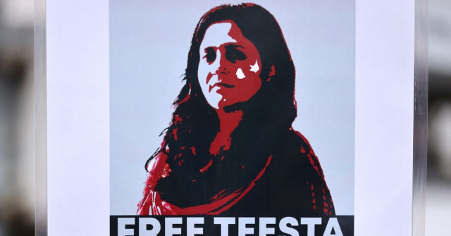 a protestor holds a placard demanding the release of activist teesta setalvad after she was arrested at her home by the anti terrorism wing of the gujarat police during a protest in mumbai india june 27 2022 reuters