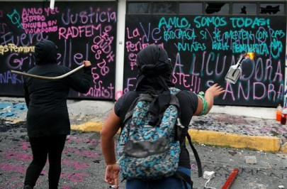 mexican activists protesting violence against women set building on fire