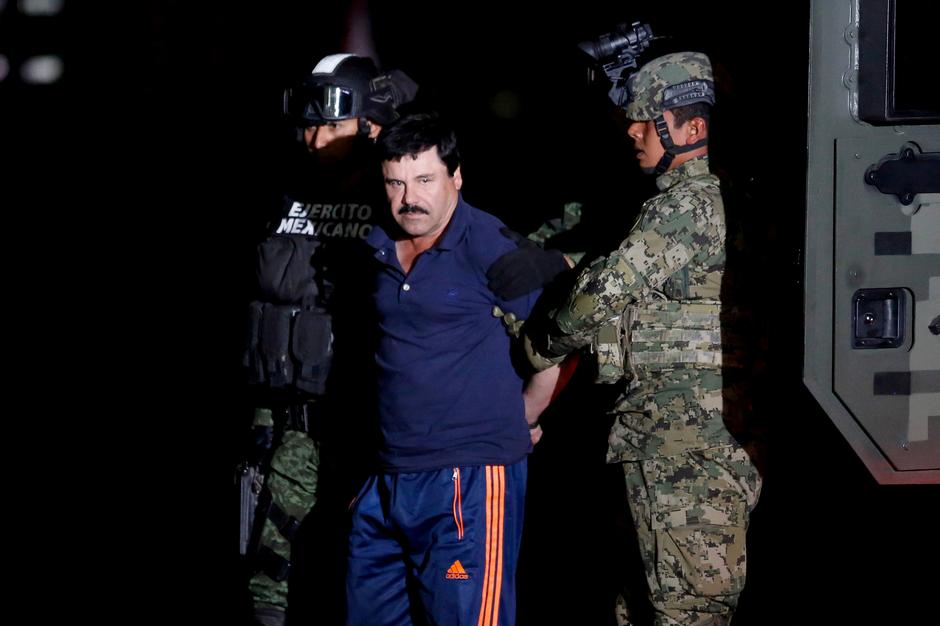 drug lord joaquin el chapo guzman is escorted by soldiers during a presentation in mexico city january 8 2016 reuters