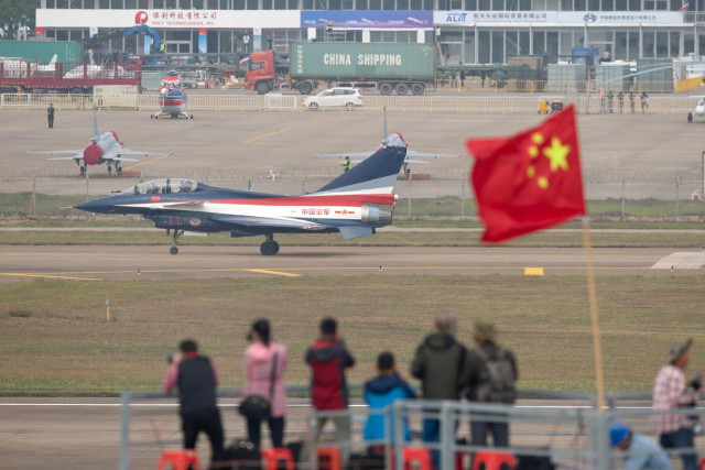 file photo people take photos of aircraft of chinese people s liberation army air force plaaf s bayi aerobatic team during a test flight ahead of the china international aviation and aerospace exhibition or zhuhai airshow in zhuhai guangdong province china november 3 2018 picture taken november 3 2018 reuters