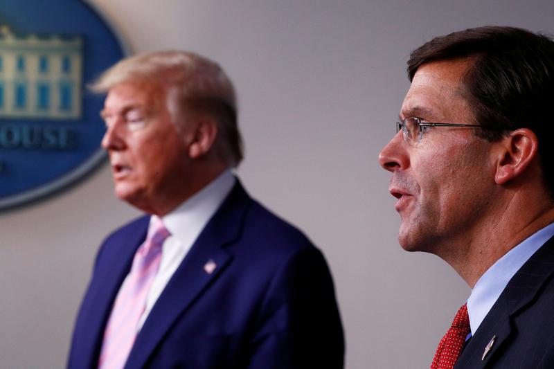 us defence secretary mark esper speaks about us military moves against venezuela as us president donald trump listens during the daily coronavirus response briefing at the white house in washington us april 1 2020 photo reuters