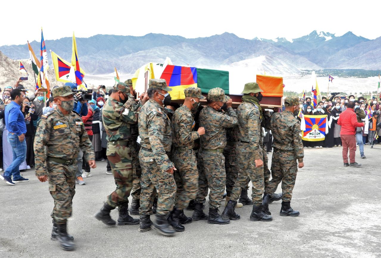 indian army soldiers carry a coffin containing the body of tenzin nyima a senior rank tibetan official from india s special frontier force during his cremation ceremony in leh september 7 2020 reuters