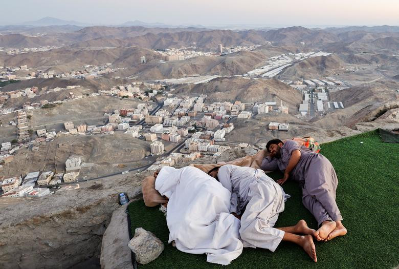 Muslim pilgrims visit Mount Al-Noor, where Muslims believe Prophet Mohammad received the first words of the Koran through Gabriel in the Hira cave, in the holy city of Mecca, Saudi Arabia, July 4, 2022.  REUTERS