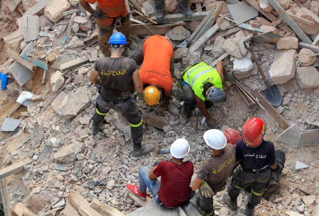 rescue team members search through buildings damaged due to the massive explosion at beirut s port area in beirut lebanon september 4 2020 reuters