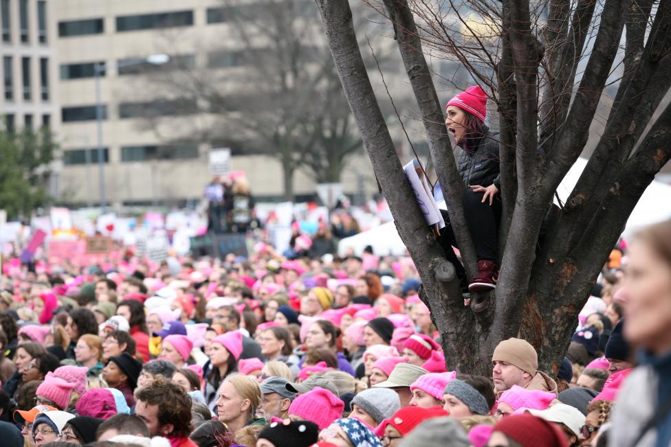 People listen to speeches at the Women's March. REUTERS/Canice Leung