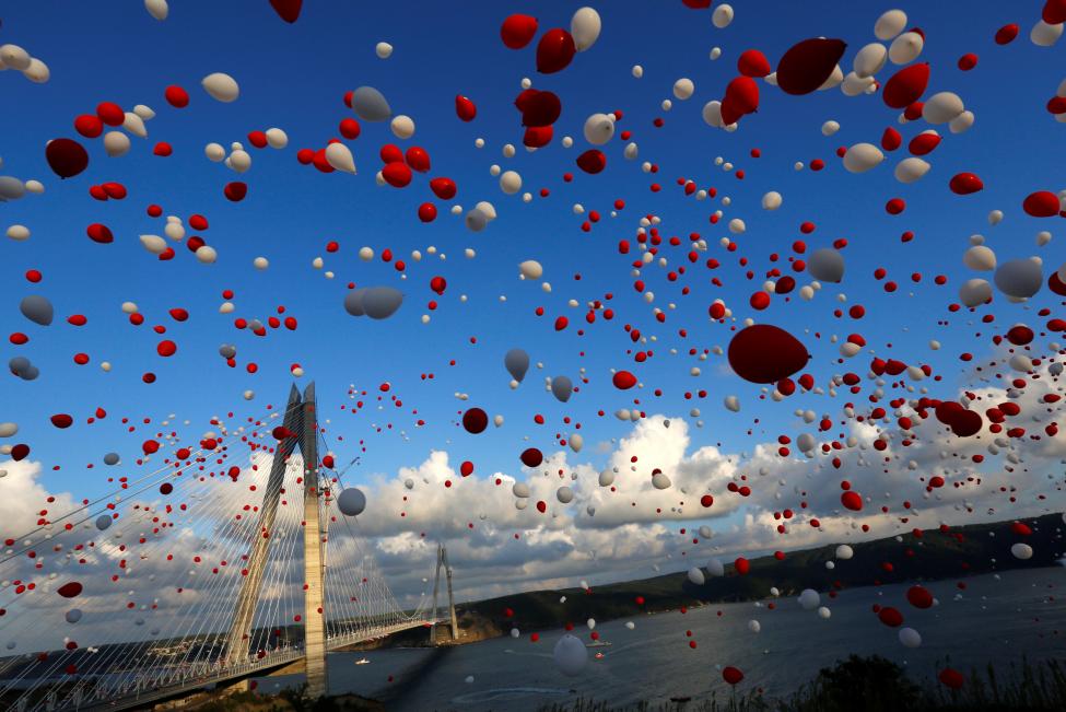 turkey red and white balloons are released during the opening ceremony of newly built yavuz sultan selim bridge the third bridge over the bosphorus linking the city s european and asian sides in istanbul turkey august 26 2016 reuters murad sezer