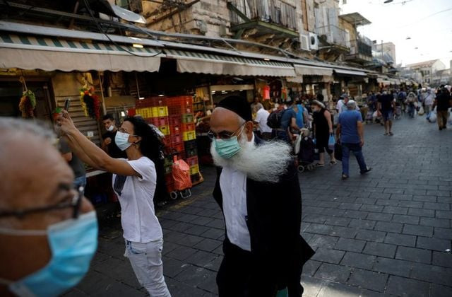 under the new rules israelis must stay within 500 metres 546 yards of home with exceptions for activities such as commuting to workplaces that will operate on a limited basis reuters