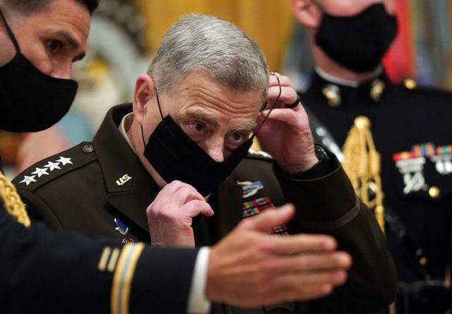 chairman of the joint chiefs of staff gen mark milley puts his face mask back on after a ceremony where u s president donald trump presented the medal of honor to u s army sgt maj thomas p payne for conspicuous gallantry during a hostage rescue mission in iraq at the white house in washington u s september 11 2020 reuters