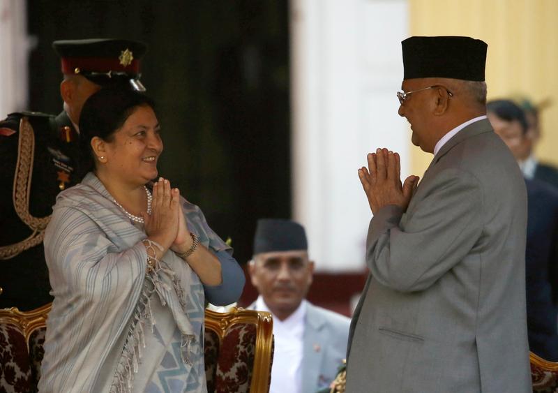 newly elected nepalese president bidhya devi bhandari greets prime minister khadga prasad sharma oli also known as kp oli after taking an oath of office at the presidential building shital niwas in kathmandu nepal march 14 2018 photo reuters file