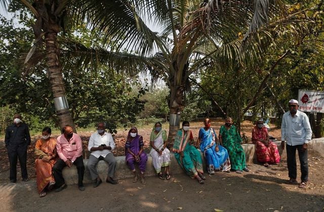 villagers wait to receives a dose of covishield coronavirus disease covid 19 vaccine manufactured by serum institute of india at a primary healthcare centre in limb village in satara district in the western state of maharashtra india march 24 2021 picture taken march 24 2021 reuters