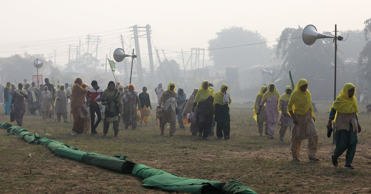 farmers gather to mark the first anniversary of their protests on the outskirts of delhi at pakora chowk near tikri border india november 26 2021 reuters