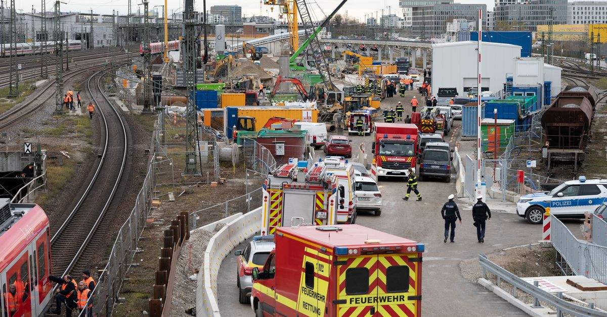 police and firefighters secure the scene after an old aircraft bomb exploded during construction work at a bridge the busy main train station injuring three people in munich germany december 1 2021 reuters