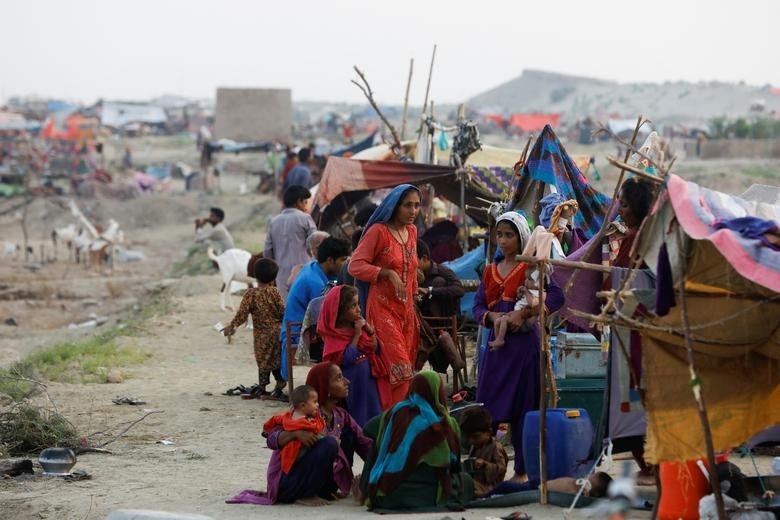 women and children who become displaced take refuge in a camp following rains and floods during the monsoon season in sehwan pakistan september 14 2022 reuters akhtar soomro