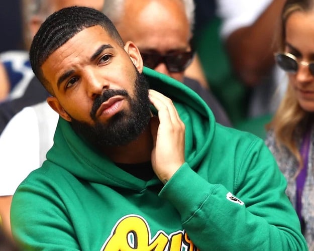 Musician Drake at a basketball game