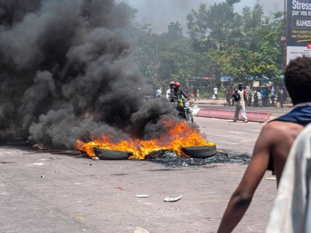 burning tires block a road during a demonstration against the escalating conflict in eastern democratic republic of congo in kinshasa on january 28 2025 photo afp burning tires block a road during a demonstration against the escalating conflict in eastern democratic republic of congo in kinshasa on january 28 2025 photo afp