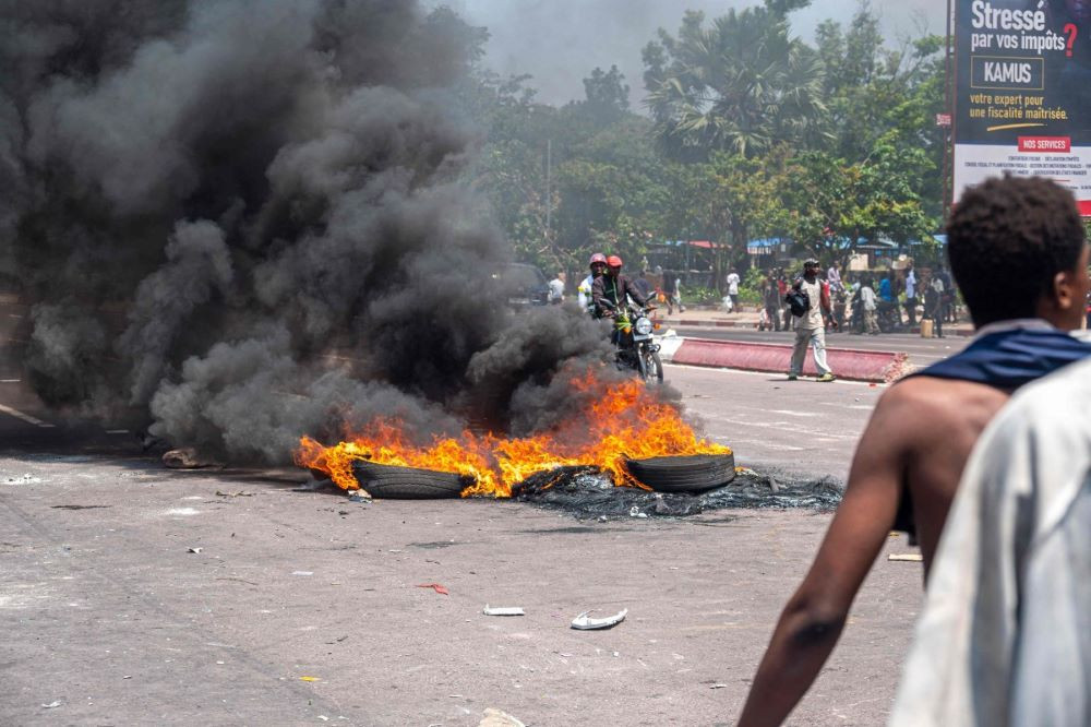 burning tires block a road during a demonstration against the escalating conflict in eastern democratic republic of congo in kinshasa on january 28 2025 photo afp