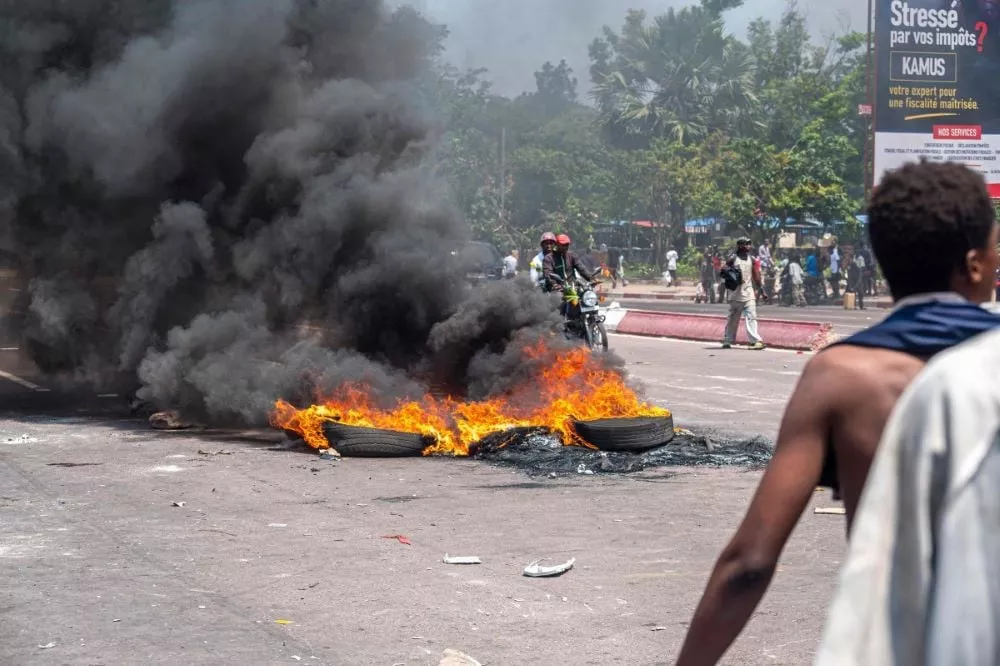 burning tires block a road during a demonstration against the escalating conflict in eastern democratic republic of congo in kinshasa on january 28 2025 photo afp burning tires block a road during a demonstration against the escalating conflict in eastern democratic republic of congo in kinshasa on january 28 2025 photo afp
