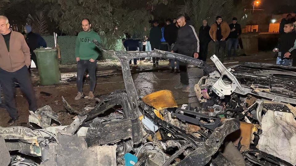 palestinians inspect the site of a deadly israeli strike on a car near jenin in the israeli occupied west bank january 24 2025 photo reuters