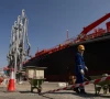 a person works near an oil tanker docked at the port of fujairah as the us israel conflict with iran limits marine traffic in the strait of hormuz in fujairah united arab emirates may 6 2026 reuters