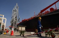 a person works near an oil tanker docked at the port of fujairah as the us israel conflict with iran limits marine traffic in the strait of hormuz in fujairah united arab emirates may 6 2026 reuters