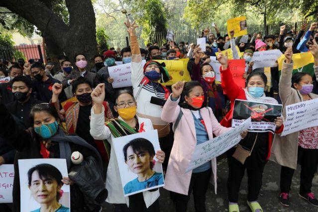 myanmar citizens living in india hold placards and pictures of aung san suu kyi during a protest organised by chin refugee committee against the military coup in myanmar in new delhi india february 5 2021 reuters