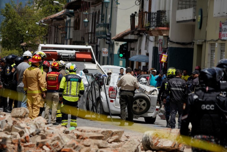 a damaged car and rubble from a house affected by the earthquake are pictured in cuenca ecuador march 18 2023 reuters rafa idrovo espinoza