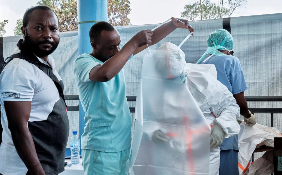 Medical team from the Alliance for International Medical Action (ALIMA), an international NGO dress up in personal protective equipment (PPE) as they set up a treatment centre for the Ebola response, as agencies intensify efforts to contain a new Ebola outbreak caused by the Bundibugyo virus strain, in Rwampara outside Bunia, Ituri province, Democratic Republic of Congo, May 29, 2026. PHOTO: AFP