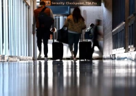travelers wait to pass a security checkpoint at dulles international airport in dulles virginia u s november 13 2025 photo reuters