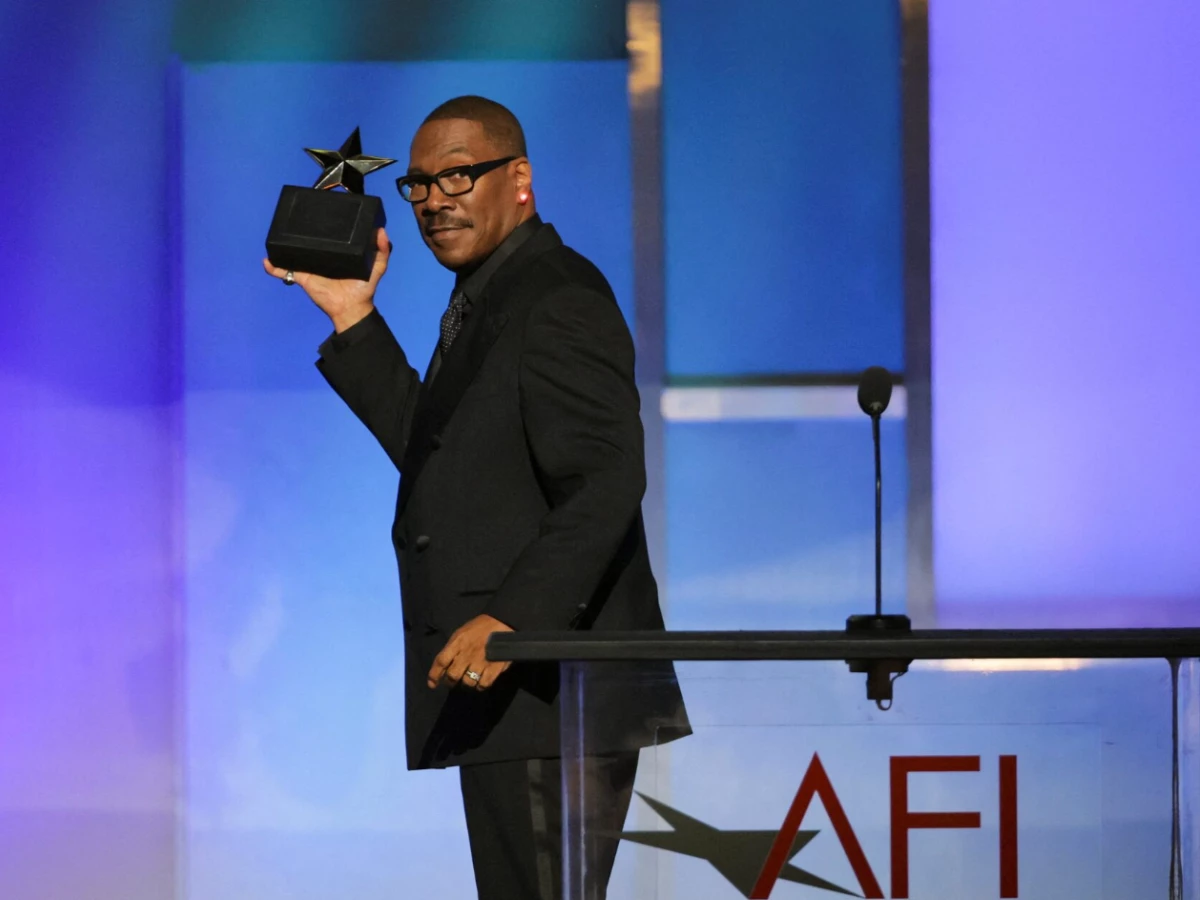 eddie murphy gestures on the stage after winning at the 51st afi life achievement award tribute gala at the dolby theatre in los angeles california u s april 18 2026 reuters daniel cole