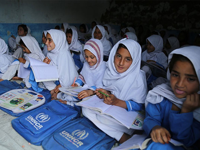 afghan refugee girls studying at the primary school khazana village pakistan photo unhcr