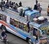 passengers ride an overcrowded bus while returning to their hometowns ahead of eidul fitr which marks the end of the islamic holy fasting month of ramazan in lahore on march 19 2026 photo afp