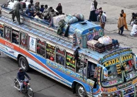 people ride an overcrowded bus while returning to their hometowns ahead of eid in lahore photo afp