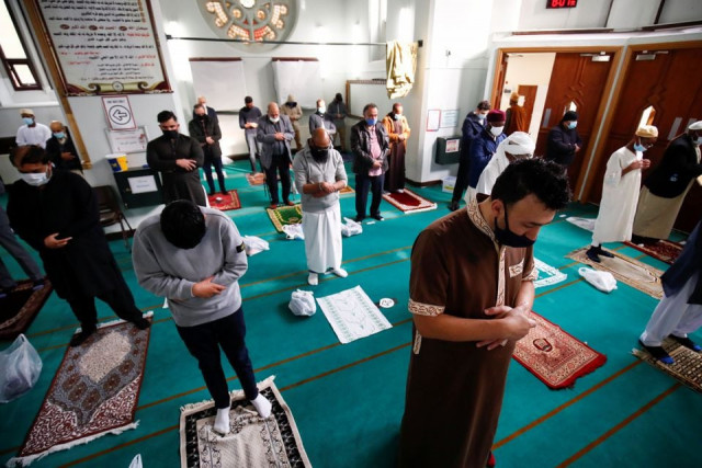 muslim worshippers attend eid al fitr prayers to mark the end of the month of ramadan amid the coronavirus disease covid 19 pandemic at didsbury central mosque in manchester britain may 13 2021 photos reuters muslim worshippers attend eid al fitr prayers to mark the end of the month of ramadan amid the coronavirus disease covid 19 pandemic at didsbury central mosque in manchester britain may 13 2021 photos reuters