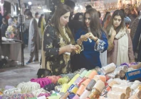 women browse bangles at a stall at islamabad s jinnah super market as shoppers gear up for the upcoming eidul fitr festival photo online