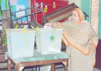 electoral moment a woman casts her vote in by election in faisalabad photo online electoral moment a woman casts her vote in by election in faisalabad photo online