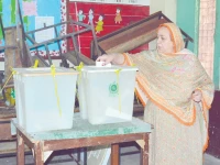 electoral moment a woman casts her vote in by election in faisalabad photo online electoral moment a woman casts her vote in by election in faisalabad photo online