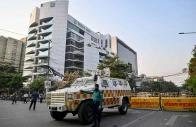 a bangladesh police personnel stands guard outside the election commission s office in dhaka on december 11 2025 ahead of the announcement of the parliamentary elections and the july national charter referendum photo afp