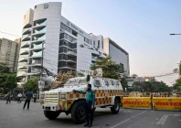 a bangladesh police personnel stands guard outside the election commission s office in dhaka on december 11 2025 ahead of the announcement of the parliamentary elections and the july national charter referendum photo afp