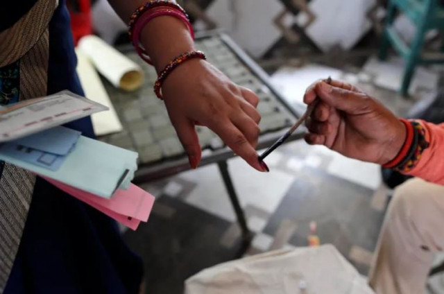 an election officer marks the finger of a voter with indelible ink during a local election in uttar pradesh state photo ap an election officer marks the finger of a voter with indelible ink during a local election in uttar pradesh state photo ap