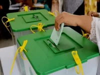 a woman casts vote during an election in pakistan photo express file